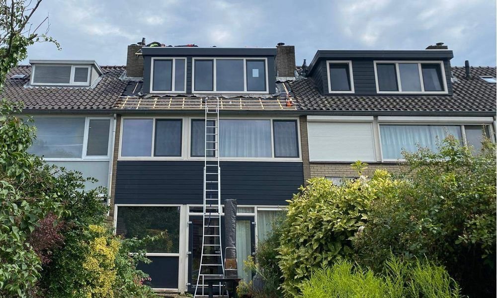 Wat kost een plat dak herstellen in Buitenpost?